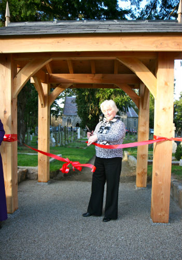 Marjorie Mold cuts the ribbon on the new lych gate at Powerscourt Church in Enniskerry. 