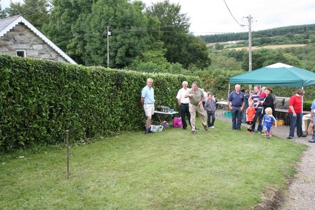 Pictured is a game of tossing the horseshoe at the Ballinatone Parish Fete in Co Wicklow.