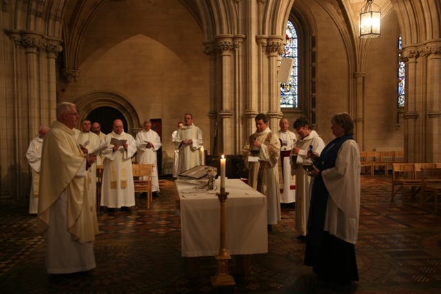 A lay reader (Barbara O'Callaghan), a Deacon (the Revd David McDonnell) and a Priest (the Revd Aisling Shine) present oil for blessing at Chrism Eucharist in Christ Church Cathedral.