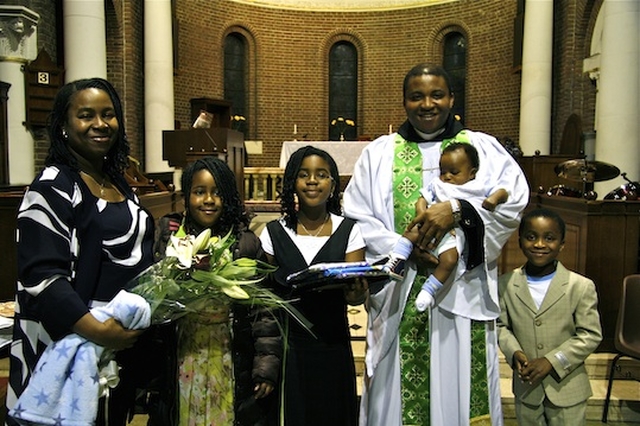 The Revd Obinna Ulogwara pictured with his wife Chika and their children.