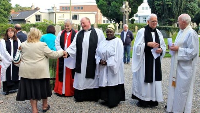 Clergy greet people who had been at the closing service for St Maelruain’s Flower Festival and Festival of Hands in Tallaght. Pictured from left are Auxiliary Priest, the Revd Avril Bennett; the Archbishop of Dublin, the Most Revd Dr Michael Jackson; the Rector of Tallaght, the Revd William Deverell; parish reader, Victoria Osho; former Rector of Tallaght and current Chaplain of the Mageough Home, the Revd Robert Kingston and Auxiliary Bishop of Dublin, the Most Revd Eamonn Walsh. 