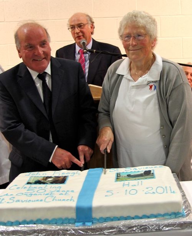 John Keogh and Annie Keegan cut a special cake baked in honour of the opening and dedication of St Saviour’s Parish Hall in Arklow. 