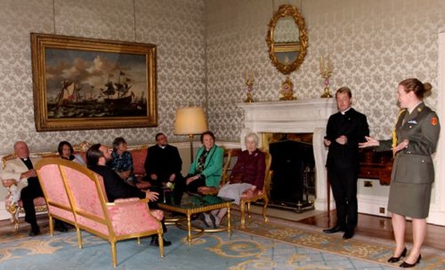 Members and friends of Cumann Gaelach na hEaglaise relaxing on the Louis xiv furniture during a tour of the State rooms of Áras an Uachtaráin let by Commandant Louise Conlon. 
