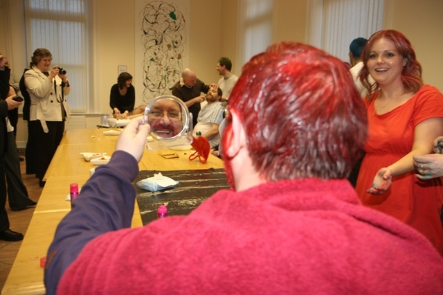 Brendan Walsh, an ordinand in the Church of Ireland Theological Institute checks out his new look having got his hair and beard dyed for Bishops' Appeal.