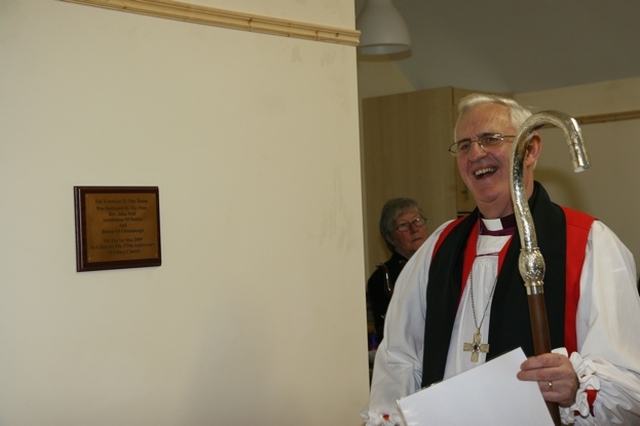 The Archbishop of Dublin and Bishop of Glendalough, the Most Revd Dr John Neill with the plaque he unveiled to mark the official opening of new parish rooms in Calary Parish Church.