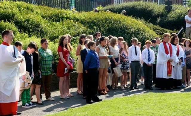 Newly confirmed young people from across Dublin & Glendalough gather outside Christ Church Cathedral following their confirmation service. 