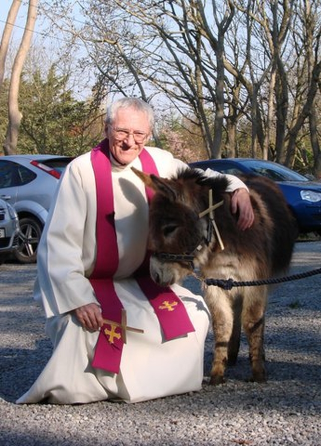 Canon Horace McKinley and Thistle the donkey prepare for Palm Sunday Procession in Whitechurch.