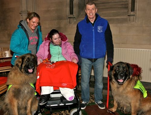 Carer Lisa Kelly, Aisling Dempsey and Gino O’Reilly with Dexter and MacGyver at the annual Peata Carol Service in Christ Church Cathedral. 