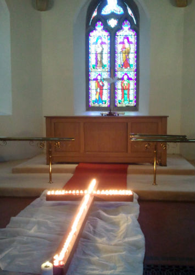 At the end of the Way of the Cross procession in Enniskerry the cross was placed on the floor of St Patrick’s Church. People placed candles on the cross as a final act of service before leaving the church.
