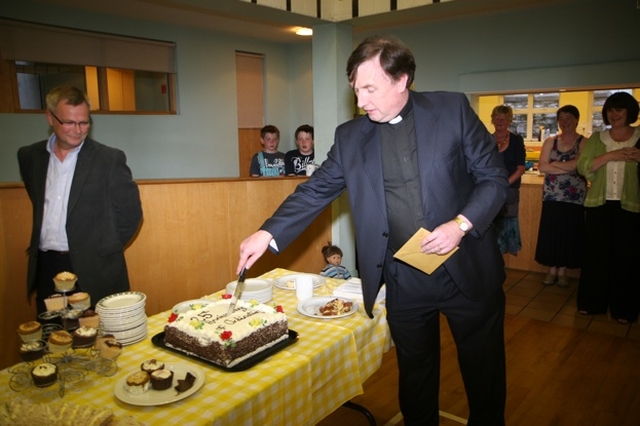 The Revd Scott Peoples, Rector of Lucan and Leixlip cutting the cake at the reception to mark the 25th Anniversary of his ordination. 