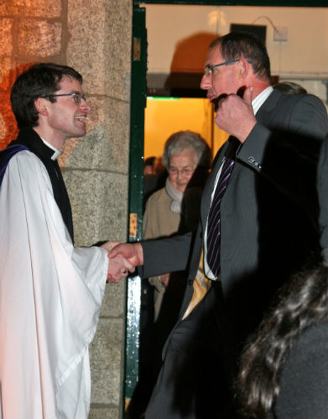 Revd Niall Sloane greets a member of the congregation following his Service of Institution at Holy Trinity Church, Killiney.