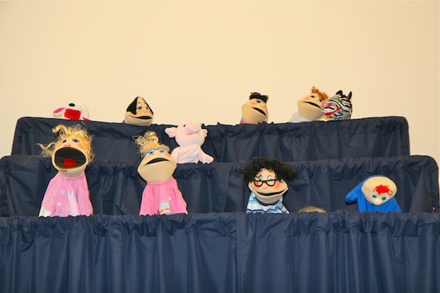 Participants showing what they learnt at the 'Using puppets for the first time' seminar at the Building Blocks Conference, All Hallows College.