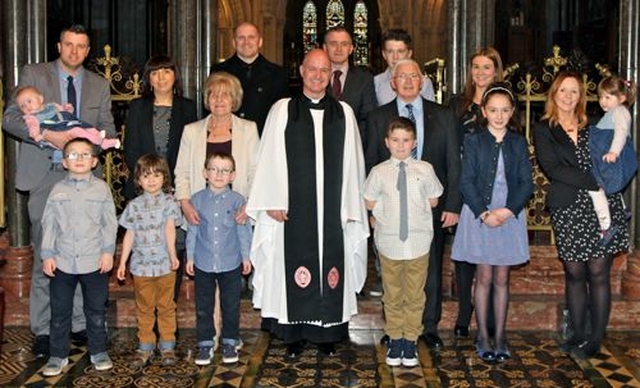 Canon David Gillespie pictured with members of his family following the service in which he was installed as a Canon of Christ Church Cathedral. 
