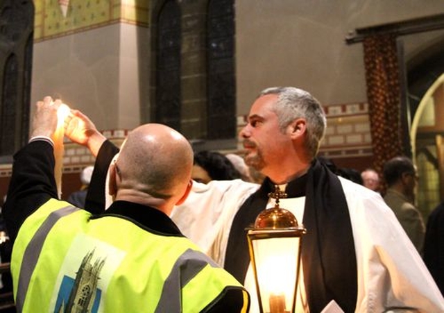 The Revd Andrew McCroskery lighting a candle in St Bartholomew’s Church, Clyde Road, during the 2014 Dublin Council of Churches Walk of Light. 