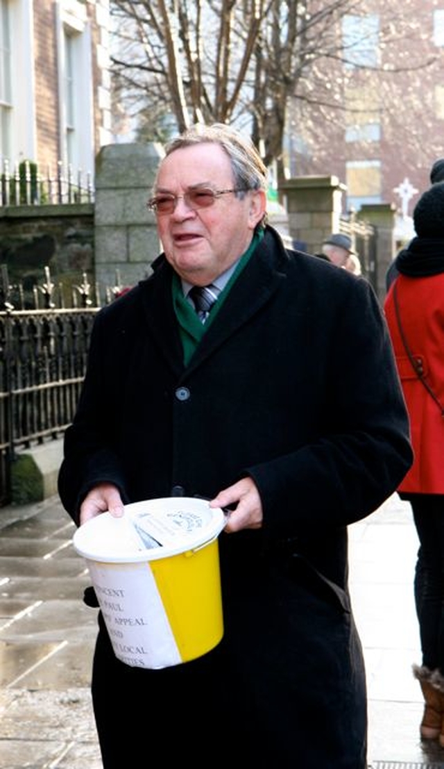 Arthur Vincent shakes a bucket outside St Ann’s Church, Dawson Street, at the launch of the 2012 Black Santa Sit Out. 