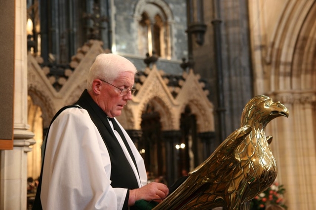 Newly installed Cathedral Canon, the Revd Canon Robert Deane reads the Gospel in Christ Church Cathedral.