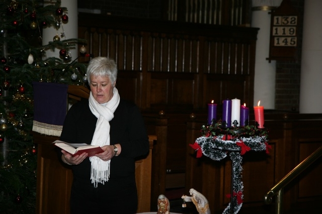 The Revd Canon Katharine Poulton reads a lesson at the Community Carols service in St Georges and St Thomas. 