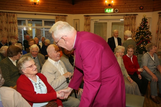 Pictured is the Archbishop of Dublin, the Most Revd Dr John Neill meeting Peg Flower at the Brabazon House Carol Service.