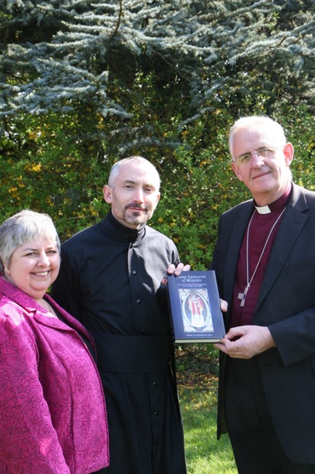 The Archbishop of Dublin, the Most Revd Dr John Neill presenting a book (Three Centuries of Mission) on behalf of USPG Ireland (The United Society for the Propagation of the Gospel) to ordinand Patrick Burke in appreciation for his work in organising the Lenten Head Shave for the Mission agency. All the Theological Institute students will receive a copy. Also pictured is Linda Chambers de Bruijn of USPG.