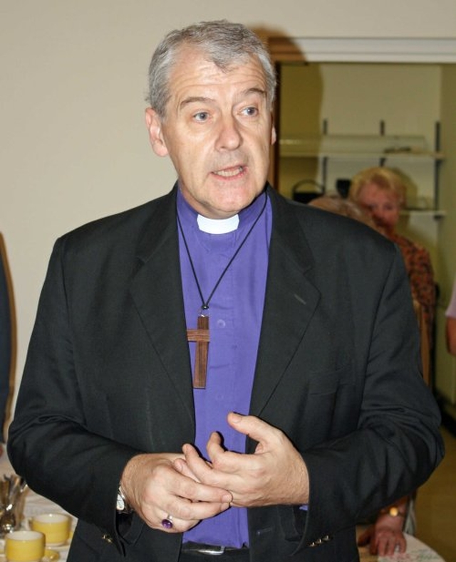 Archbishop Jackson speaking at the reception following the re–dedication of the Mageough Home Chapel.