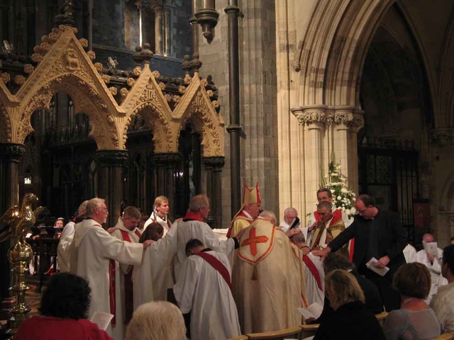 The laying on of hands at the ordination of the Revd Alan Barr, Curate of Bray (right) and the Revd Rob Jones, Curate of CORE.