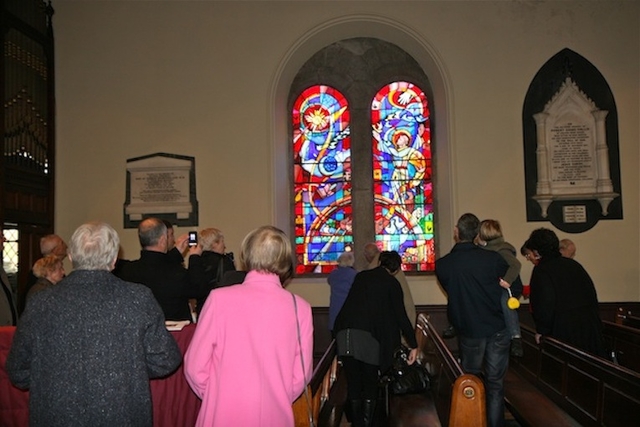 The congregation admire the new St Francis stained glass window in Sandford Parish Church. The window is in memory of the Threlfall family.