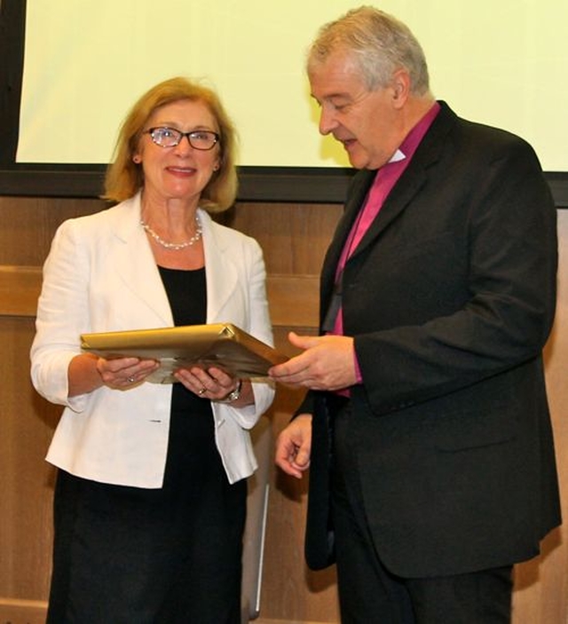 Archbishop Michael Jackson making a presentation to Minister Jan O’Sullivan at the Faith and Partnership Conference. 