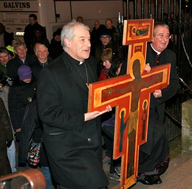 The Church of Ireland and Roman Catholic Archbishops of Dublin, Michael Jackson and Diarmuid Martin, arrive at the Pro Cathedral at the end of the Ecumenical Procession of the Cross which started at Christ Church Cathedral on Good Friday. 