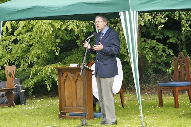 David Turner from 'Church in Chains' speaking at St Doulagh's Annual Open Air Service of Praise and Thanksgiving in St Doulagh's Field, Malahide Road, Balgriffin.