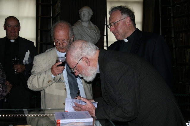 The Revd Dr Billy Marshall signing copies of his book 'Scripture, Tradition and Reason' at its launch in Trinity College Dublin.