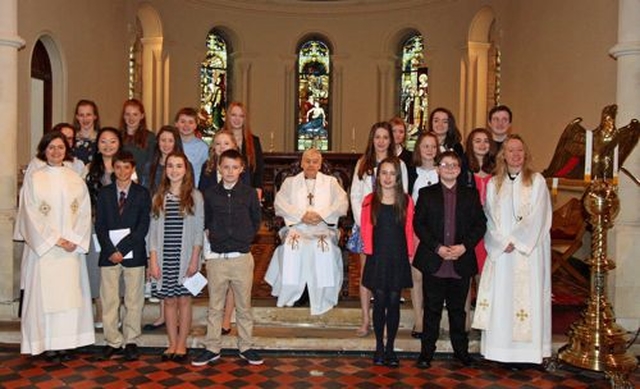 Archbishop Michael Jackson confirmed young people from Sandford, St Philip’s, Milltown and Alexandra College in Sandford Church on Sunday March 2. He is pictured with the candidates, Rector, the Revd Sonia Gyles and the Revd Anne Marie O’Farrell. 