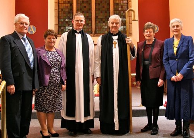 The newly instituted incumbent of the new parish of St Catherine and St James with St Audoen, Canon Mark Gardner, with Archbishop Michael Jackson and the church wardens in the Church of St Catherine and St James. 