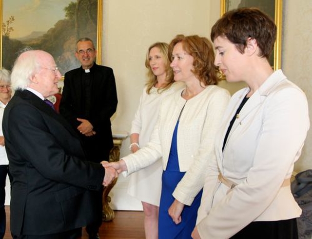 Teachers from Wesley College Dublin are greeted by President Michael D Higgins during Cumann Gaelach na hEaglaise’s reception at Áras an Uachtaráin. 