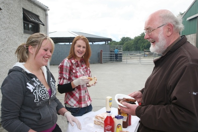 Donna Moody and Jill Hanbridge provide the grub for the Rector, the Revd Declan Smith at the Donard and Dunlavin Parish Ride out and BBQ in Moat Farm, Donard.