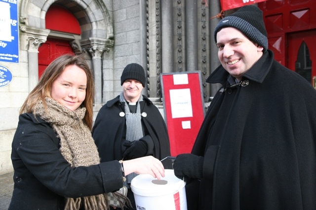 Another donation for the 'Black Santa' Haiti Earthquake Appeal received by the Curate of St Ann's, the Revd Victor Fitzpatrick. Also pictured (centre) is the Vicar of St Ann's, the Revd David Gillespie (aka Black Santa).