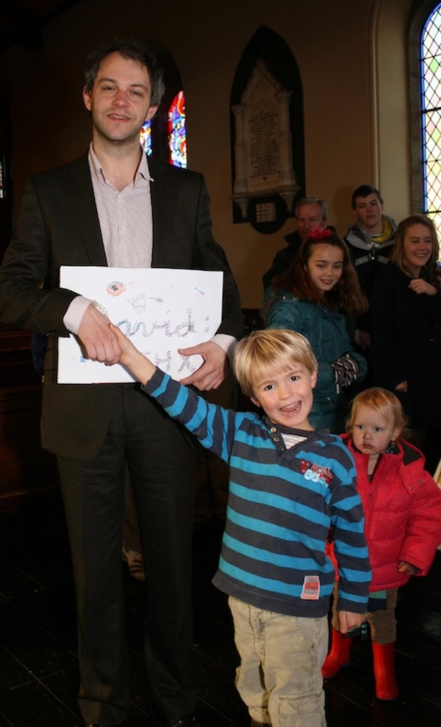 David Bremner, former organist with Sandford parish, receiving a Thank You card from the local Sunday School. Photo: David Wynne