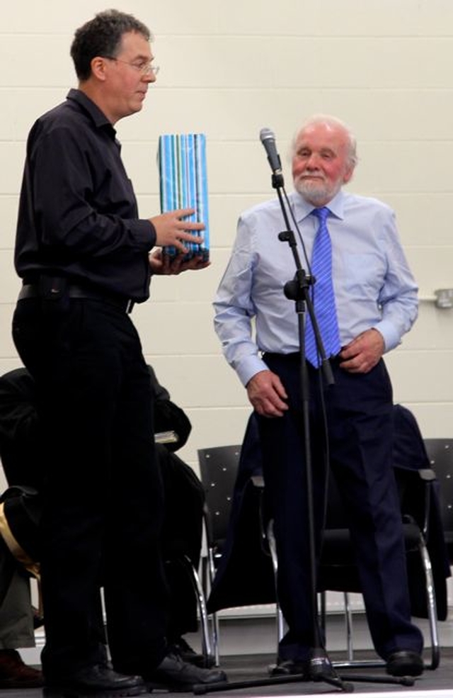 Chairman of the building committee, Mervyn Garrett, is presented with a gift at the opening and dedication of the Newcastle and Newtowmountkennedy Parish Centre. 