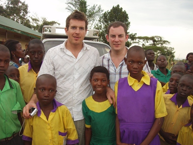 Ian Taylor (centre left) and Graham Kinch with pupils of Mount Everest Primary School, Kitandwe, Uganda which was constructed by Fields of Life through funds raised through their climb of Mount Blanc, Kilimanjaro, Cerro Aconcagua and Mount Everest.