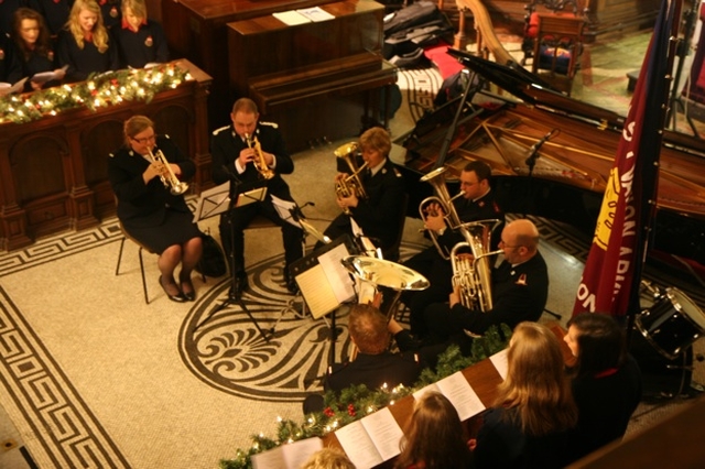 The Band of the Salvation Army with members of the Wesley College Choir at the Salvation Army Carol Service in St Ann's Church, Dawson Street.