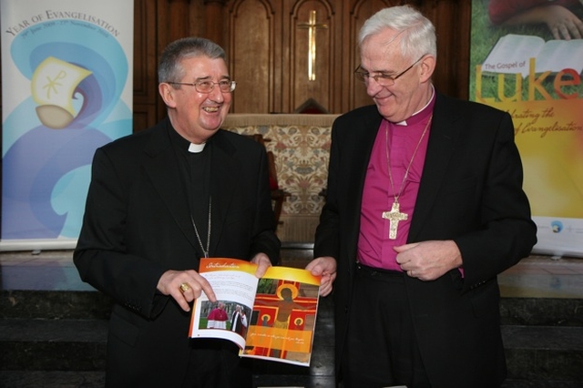 The Most Revd Diarmuid Martin and the Most Revd Dr John Neill with the Gospel of Luke, jointly produced as an inititiave by the Roman Catholic Archdiocese of Dublin and the Church of Ireland United Dioceses of Dublin and Glendalough.