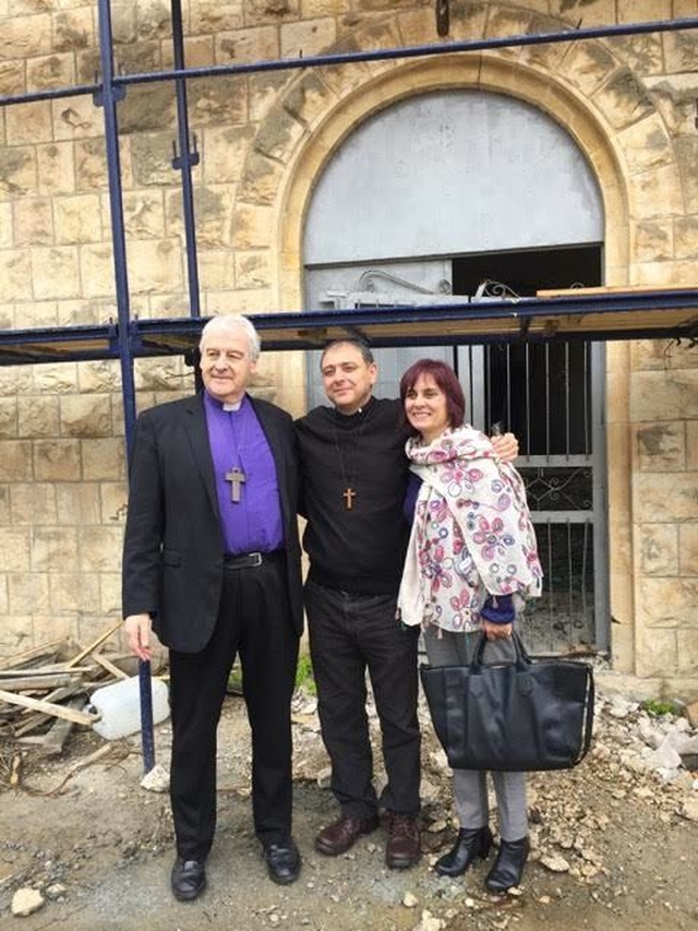 Archbishop Michael Jackson, Canon Hatem and Mrs Elizabeth Shehadeh outside Akko Church which is being restored having been closed since 1948. (Photo: Linda Chambers)