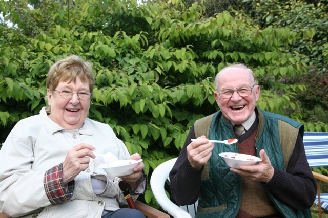 Pictured enjoying their Strawberries and cream at a strawberry and wine reception in Sandford Parish are Jean Darling and Joe Darling.