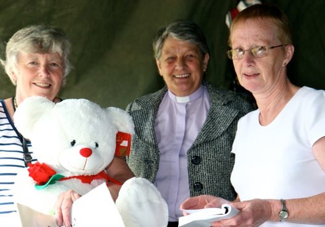 Heather Moody, Revd Olive Henderson and Ruth Fisher prepare for the auction at Donoughmore Parish Fete. 