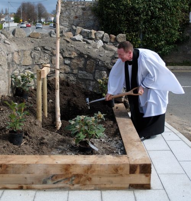 The Revd Arthur Young planting a tree to mark the 150th anniversary of Kill O’ the Grange Church. (Photo: Peter Rooke)