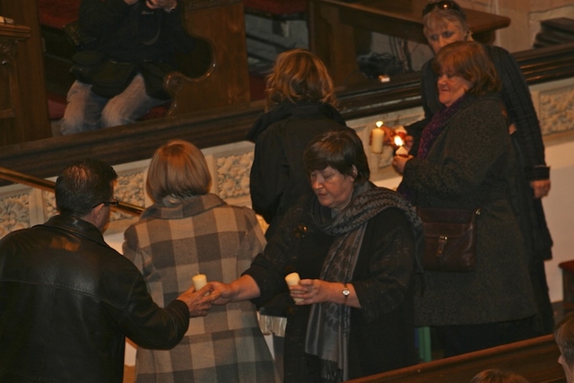 The lighting of candles at the Sudden Adult Cardiac Death Syndrome Memorial Service in Monkstown Parish Church.