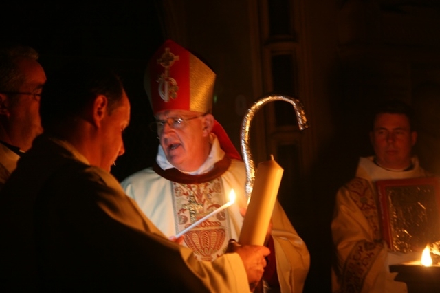 The Archbishop of Dublin, the Most Revd Dr John Neill lighting the Paschal Candle at the Easter Vigil in Christ Church Cathedral.