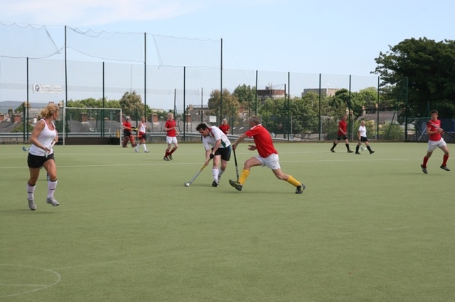 Action from the Diocesan Inter-Parish Hockey Tournament in Booterstown. Whitechurch (red) versus Newcastle (white). The game ended 0-0.