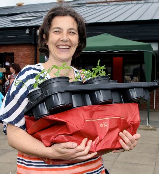 Jane Hastie laden down with her purchases from Wicklow Parish Fete in East Glendalough School. 
