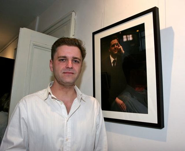 Gavin Elliot poses beside his portrait which forms part of the exhibtion ‘Reflections’ by Maeve McCarthy and Mella Travers, which is the first to take place in the new St Michan’s community art gallery. 