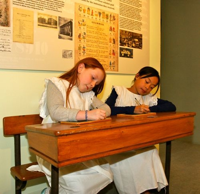 Children practice their writing skills on the old slates at the launch of the Kildare Place Society & Schooling in the Nineteenth Century exhibition in the National Museum of Ireland Collins Barracks. 